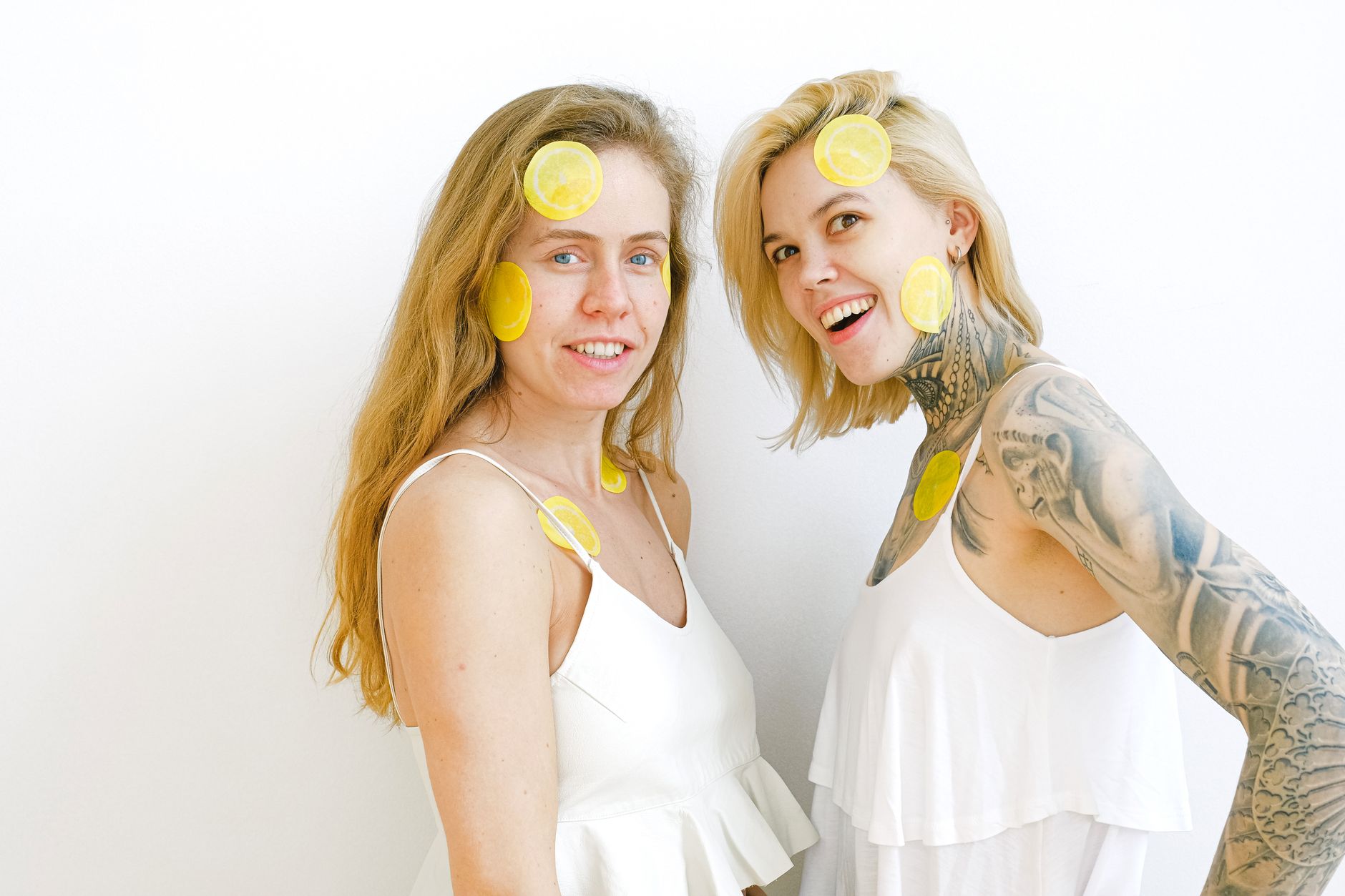 Bright yellow lemons on a pastel green background, symbolizing freshness and new beginnings