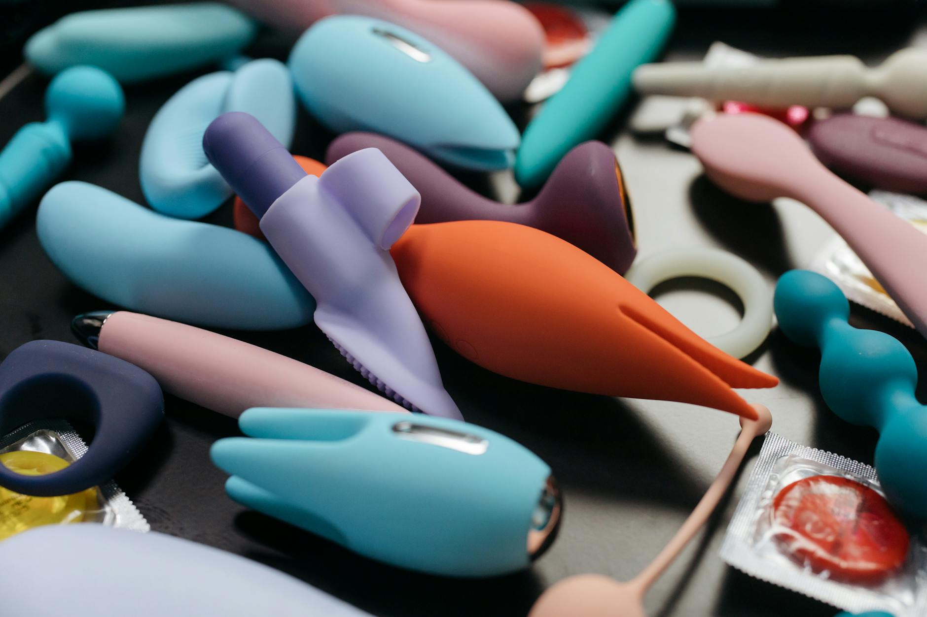 Vibrant collection of clitoral vibrators and pleasure devices in close-up view